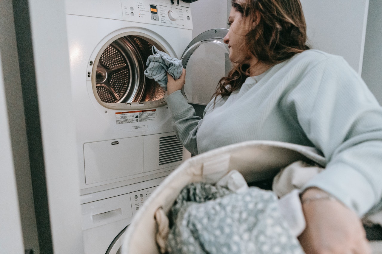 can mold on clothes spread -- woman doing the laundry